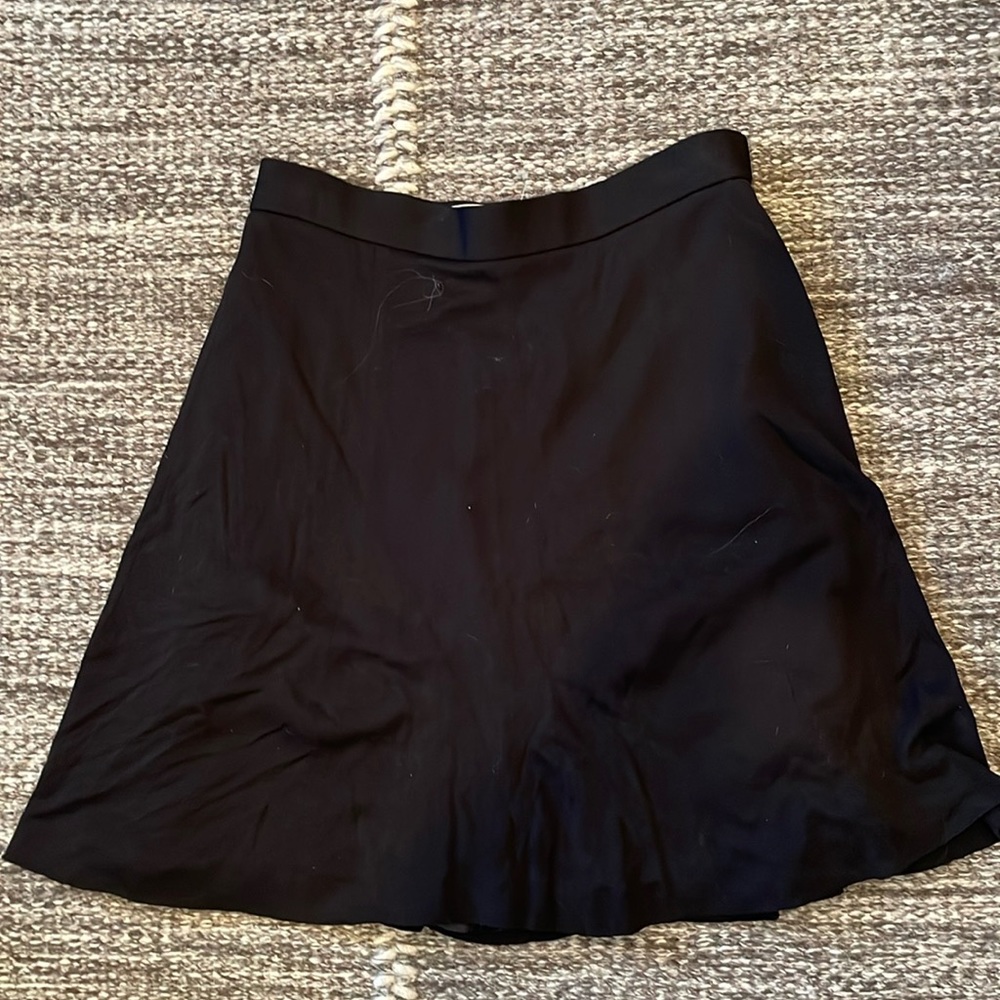 Classic black skirt, slight flare, hits mid thigh, sz 4
